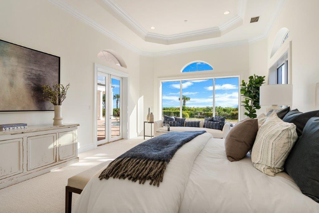 181 Ocean Beach Trail Vero Beach, FL 32963 - Photo 7 of 35 a bedroom with a bed and a flat screen tv