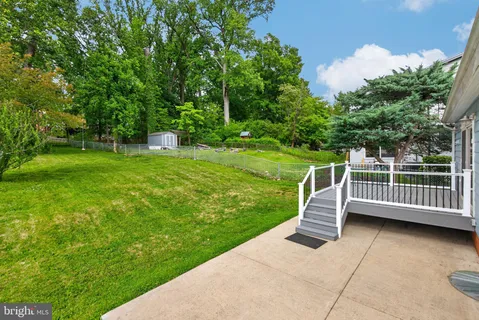 a view of a deck with a yard
