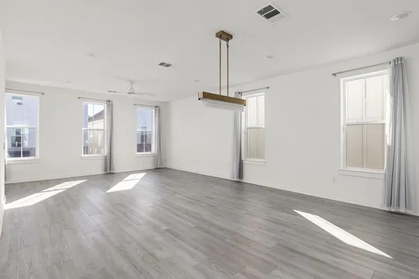 a bed room with a bed mirror and a window