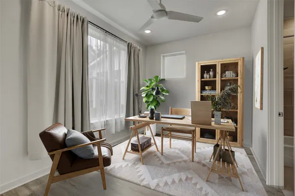 a bathroom with a sink toilet a vanity and bathtub