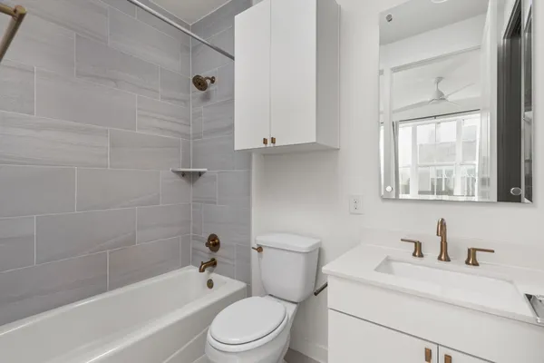 a kitchen with stainless steel appliances wooden cabinets and a stove
