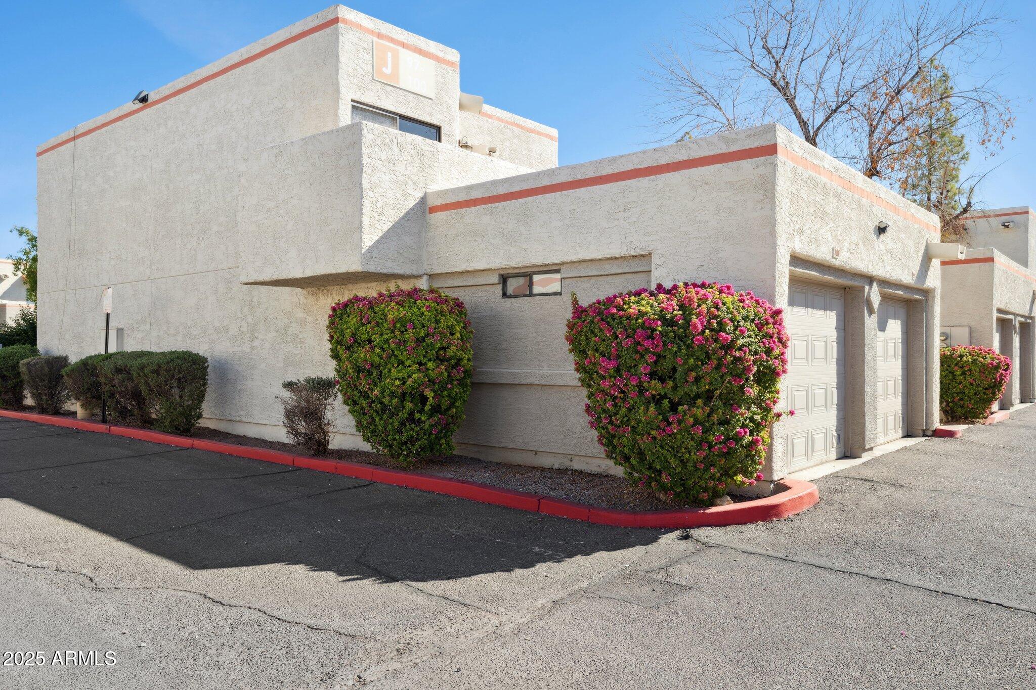 935 North Granite Reef Road, Unit 100 Scottsdale, AZ 85257 - Photo 1 of 35 a view of a street with potted plants