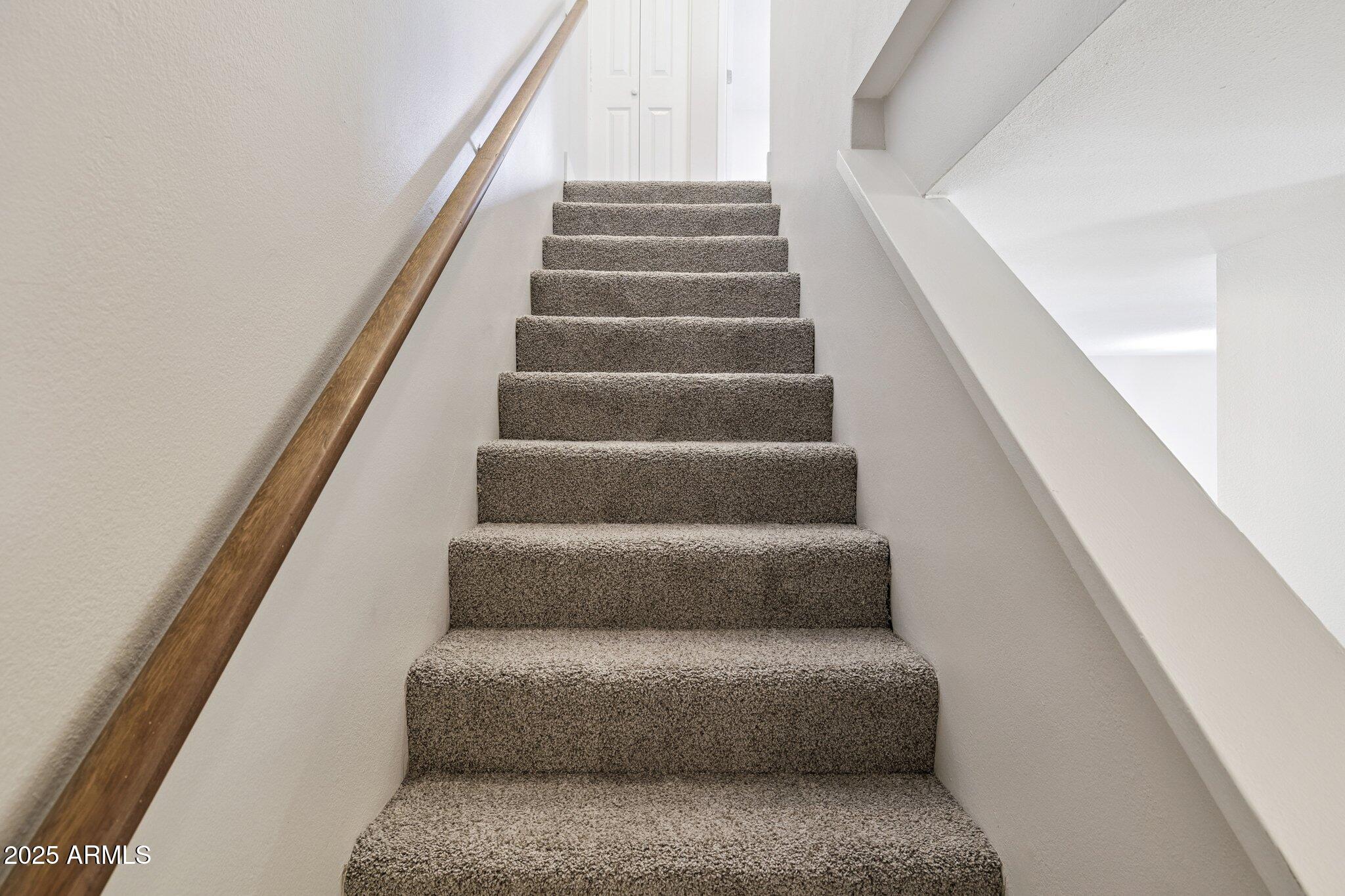 935 North Granite Reef Road, Unit 100 Scottsdale, AZ 85257 - Photo 12 of 35 a view of staircase with white walls