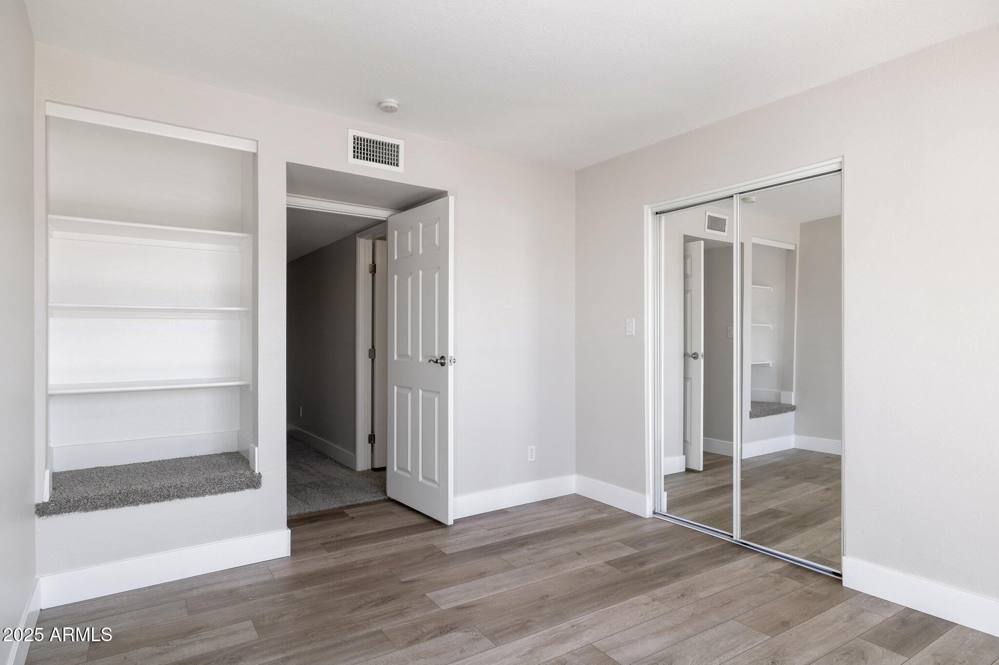 935 North Granite Reef Road, Unit 100 Scottsdale, AZ 85257 - Photo 20 of 35 a view of wooden floor and closet in a room