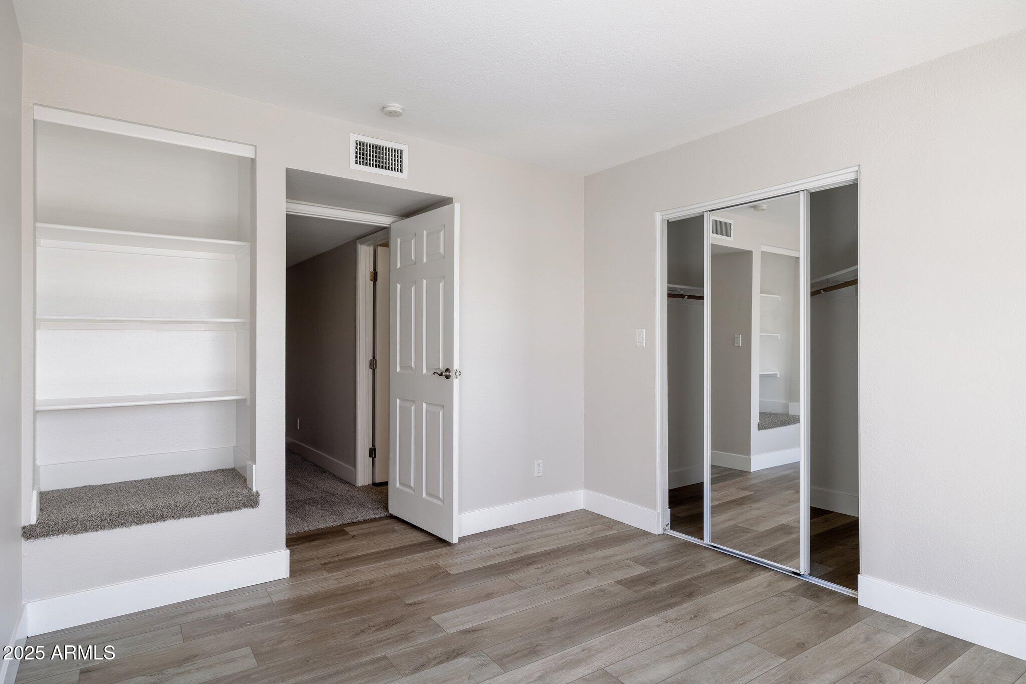 935 North Granite Reef Road, Unit 100 Scottsdale, AZ 85257 - Photo 22 of 35 a view of empty room with wooden floor