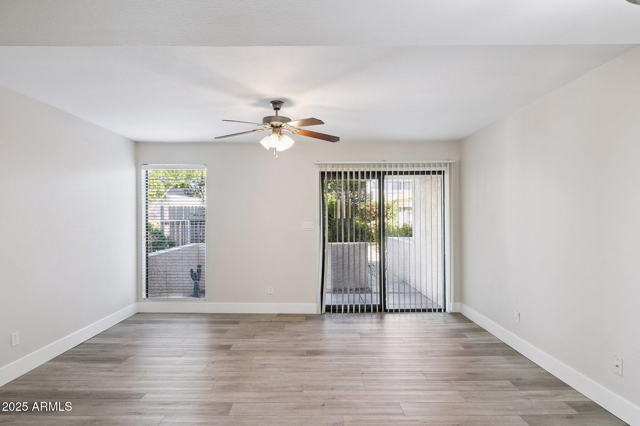 935 North Granite Reef Road, Unit 100 Scottsdale, AZ 85257 - Photo 4 of 35 wooden floor in an empty room with a window