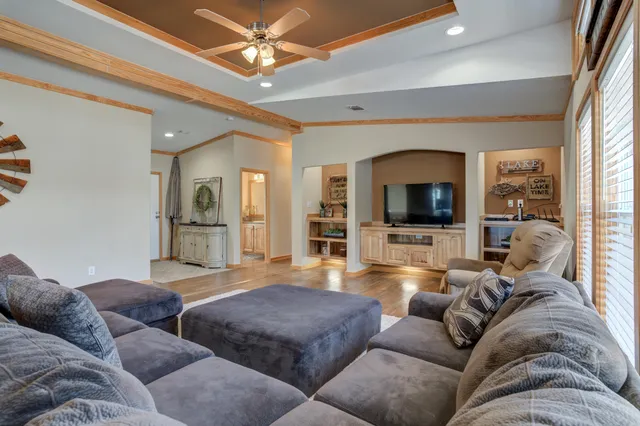 a kitchen with stainless steel appliances granite countertop sink stove top oven and cabinets