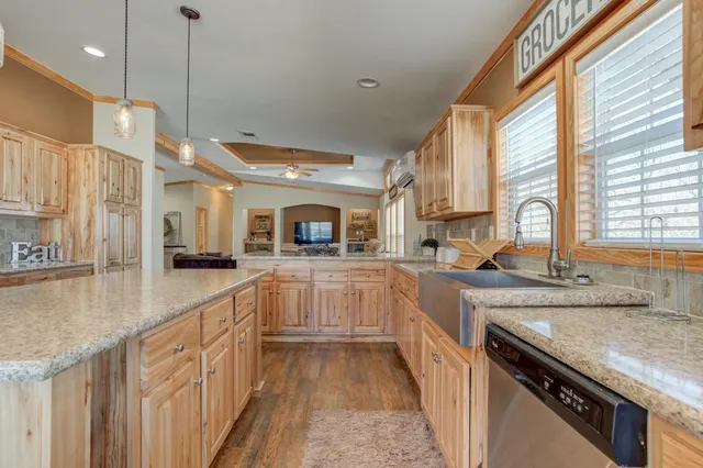 a bedroom with a bed a clock and a window