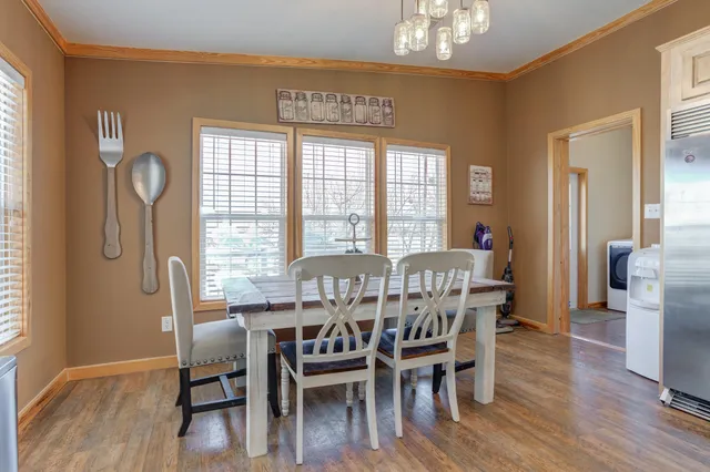 a bathroom with a double vanity sink a toilet and a mirror