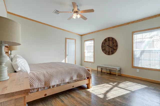 a bathroom with a granite countertop bathtub shower and sink