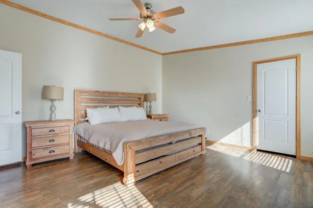 a bathroom with a granite countertop sink a toilet and a mirror