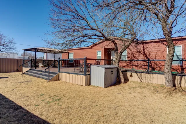 a bathroom with a sink a toilet a mirror and shower