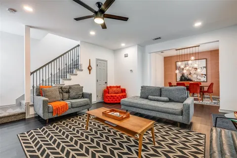a living room with furniture and a rug
