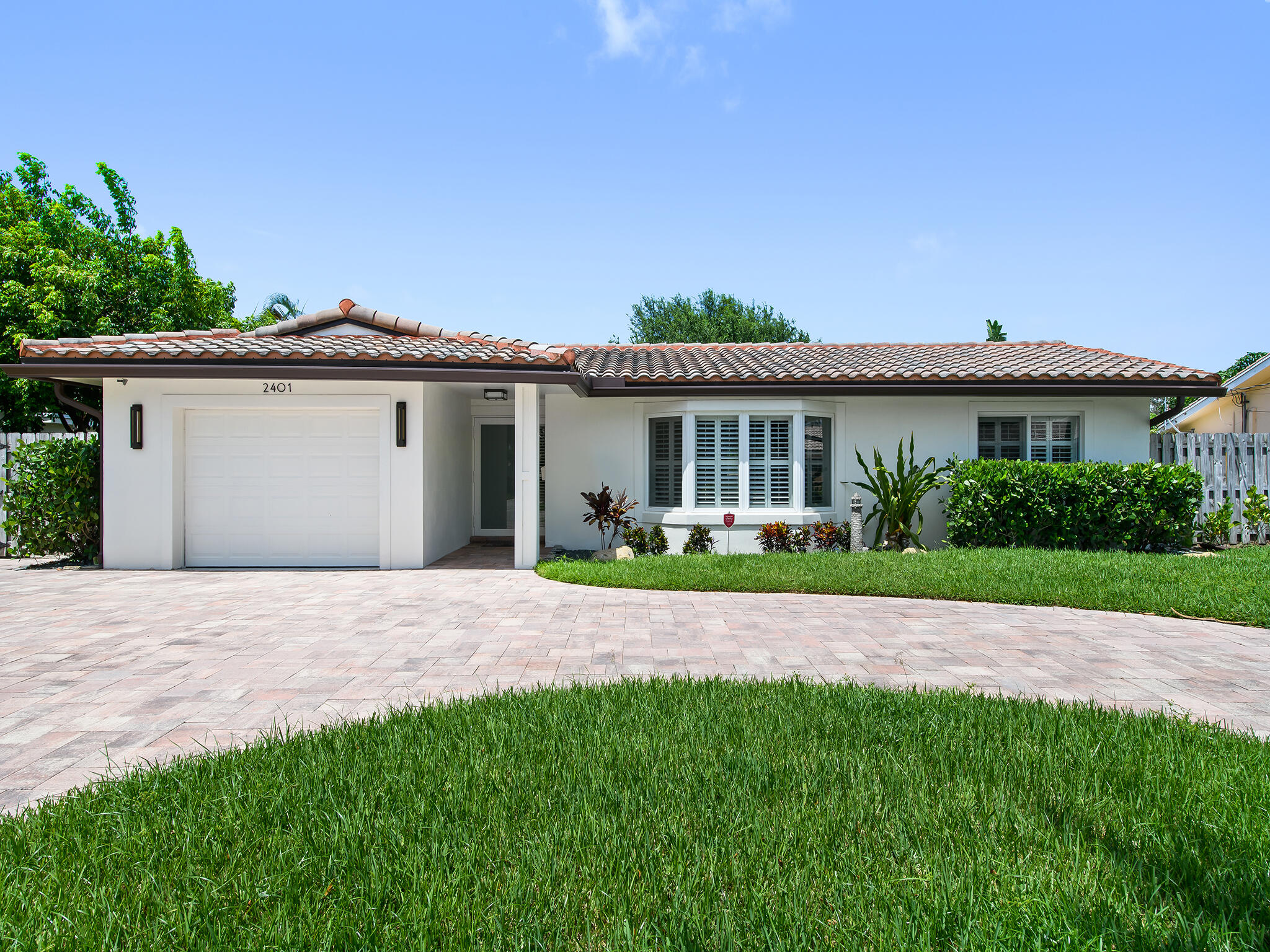 2401 Northeast 45th Street Lighthouse Point, FL 33064 - Photo 1 of 27 a view of outdoor space yard and front view of a house