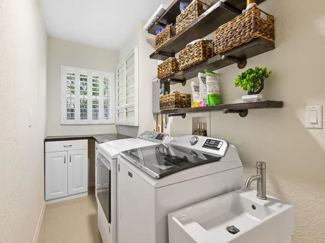 a kitchen with a sink and a stove