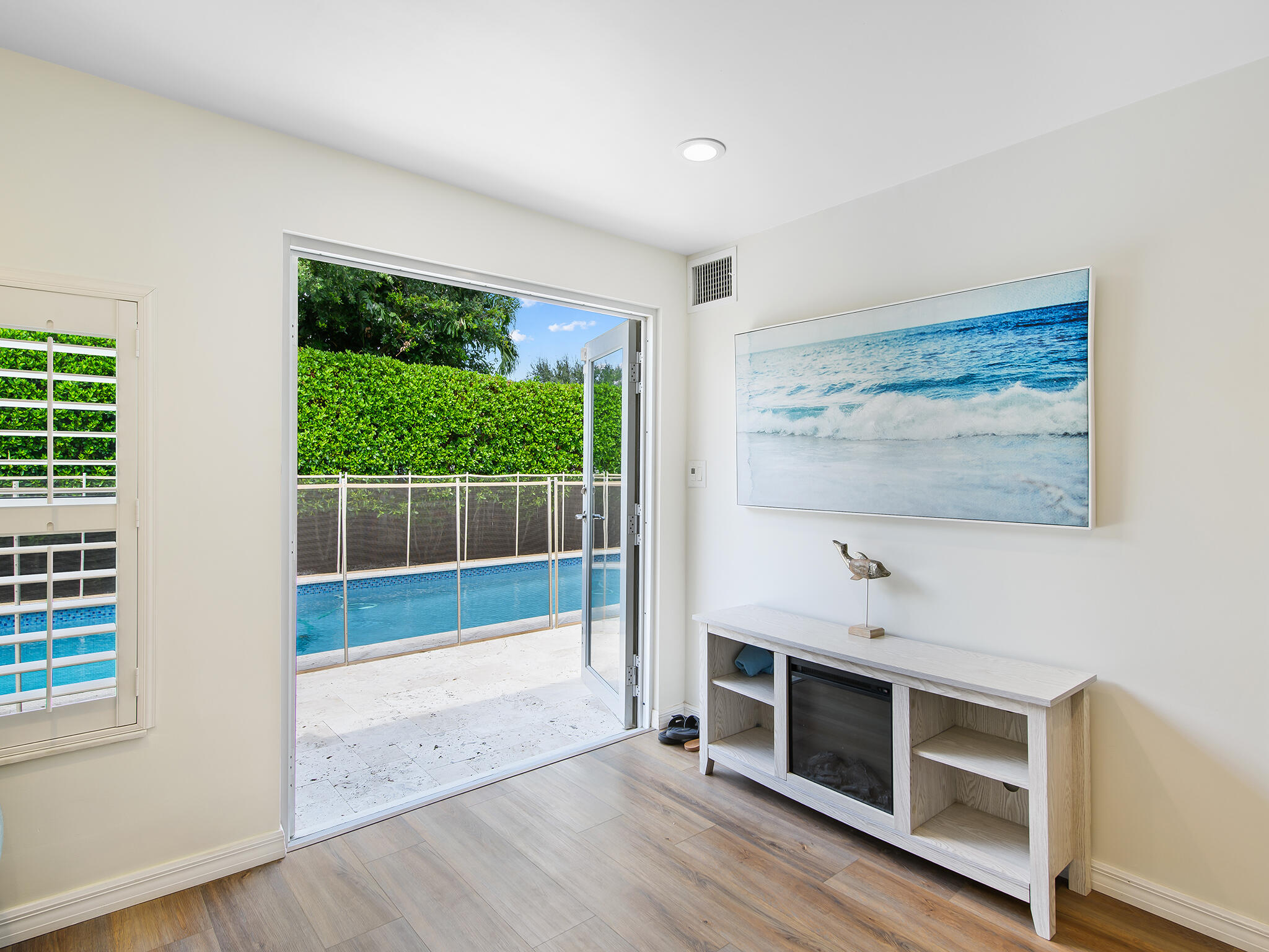 2401 Northeast 45th Street Lighthouse Point, FL 33064 - Photo 19 of 27 a bedroom with furniture and a window