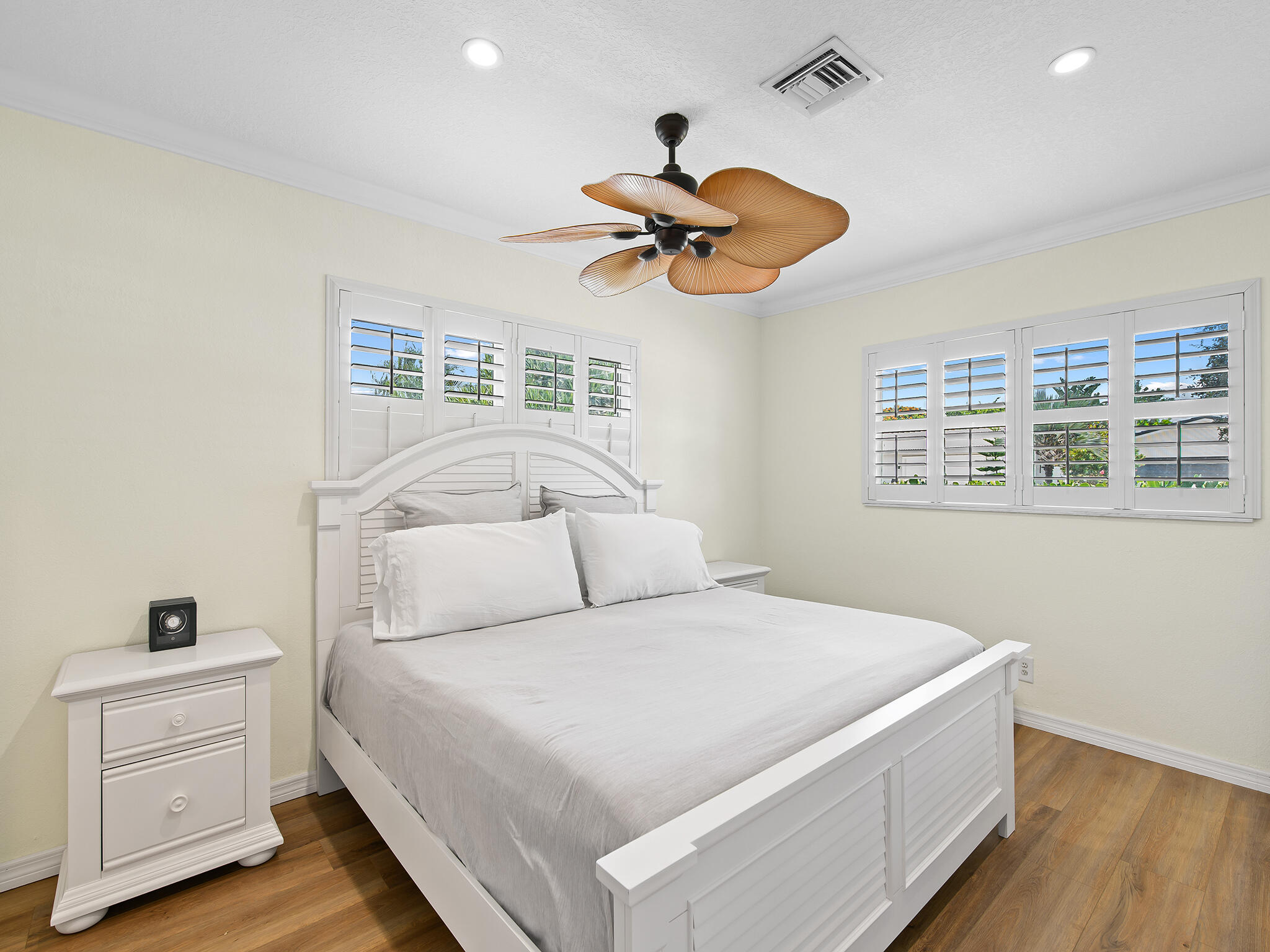 2401 Northeast 45th Street Lighthouse Point, FL 33064 - Photo 24 of 27 a bedroom with a large bed and a chandelier