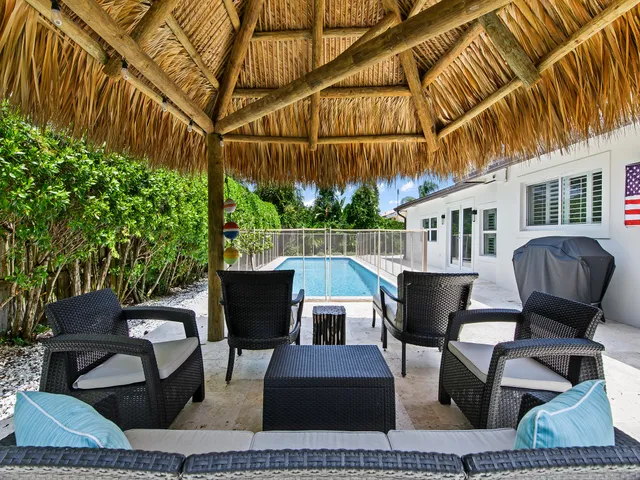 a view of a chairs and table in the patio