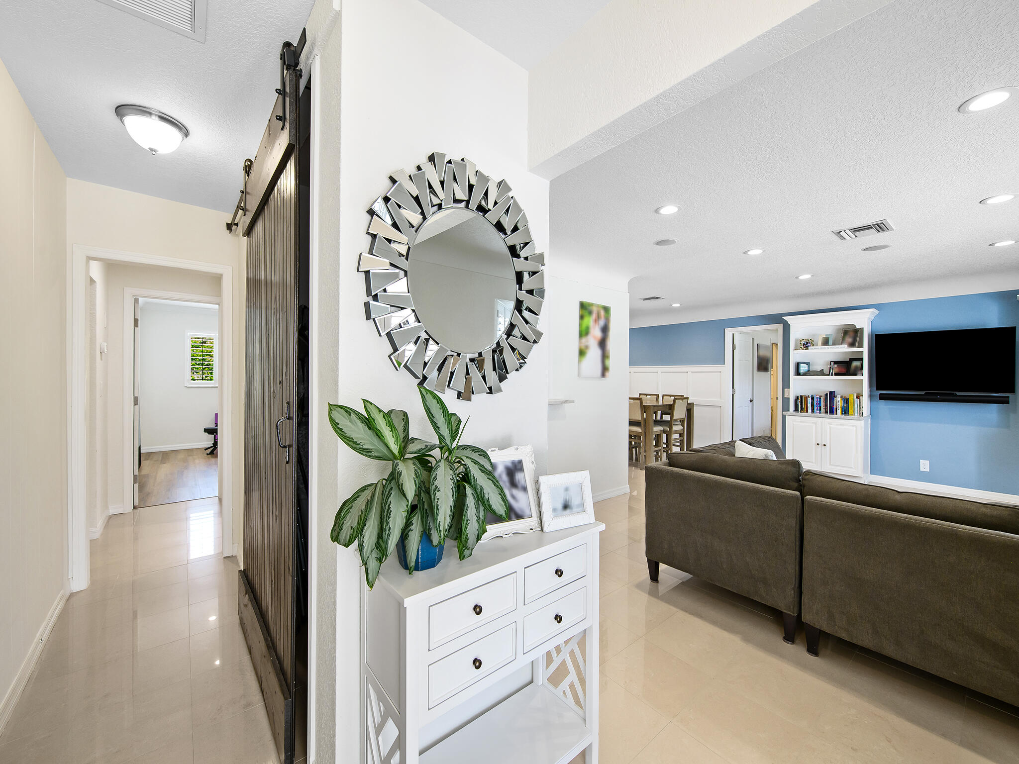 2401 Northeast 45th Street Lighthouse Point, FL 33064 - Photo 10 of 27 a living room with furniture mirror and a potted plant