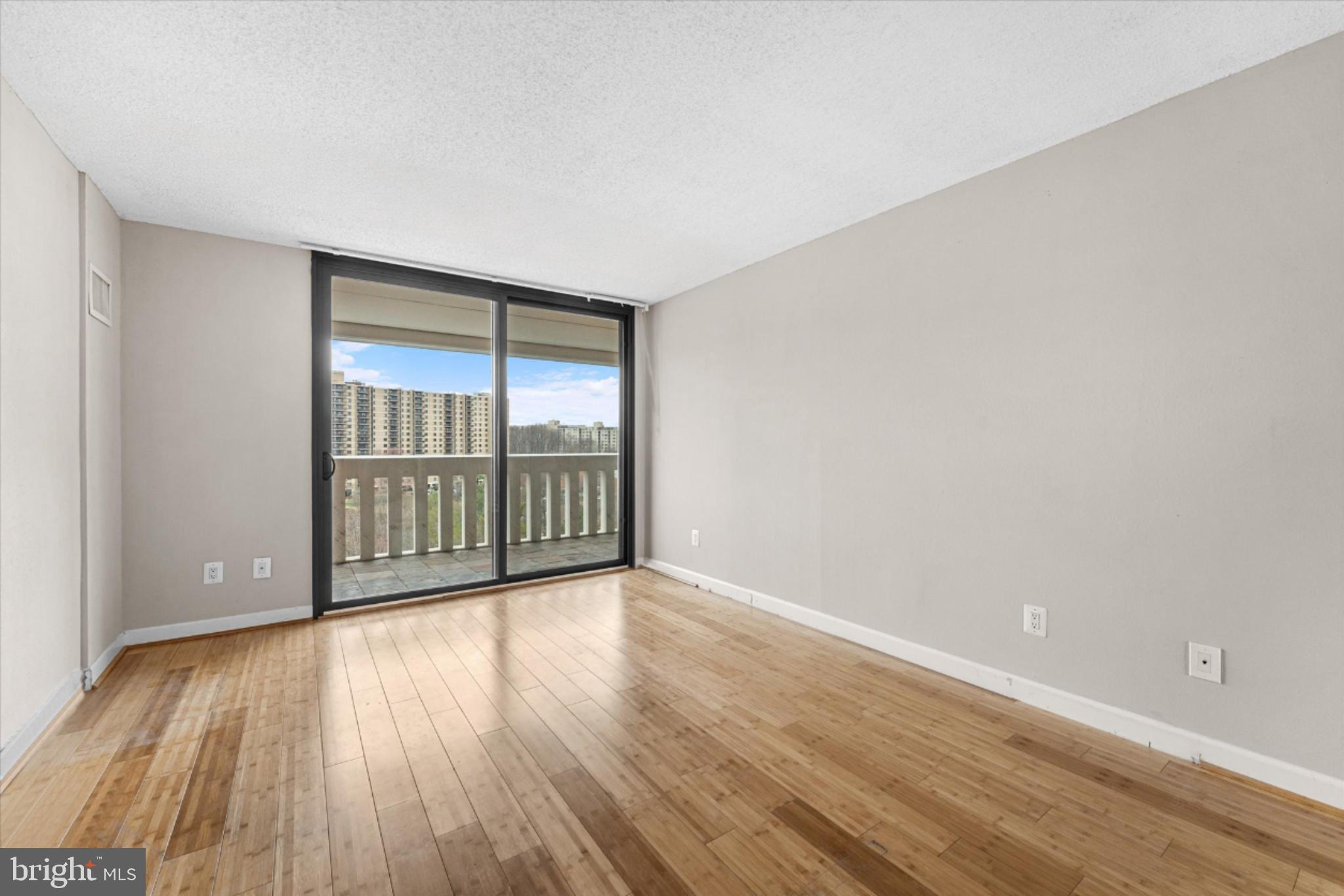 6101 Edsall Road, Unit 1402 Alexandria, VA 22304 - Photo 21 of 37 a view of a room with wooden floor and windows