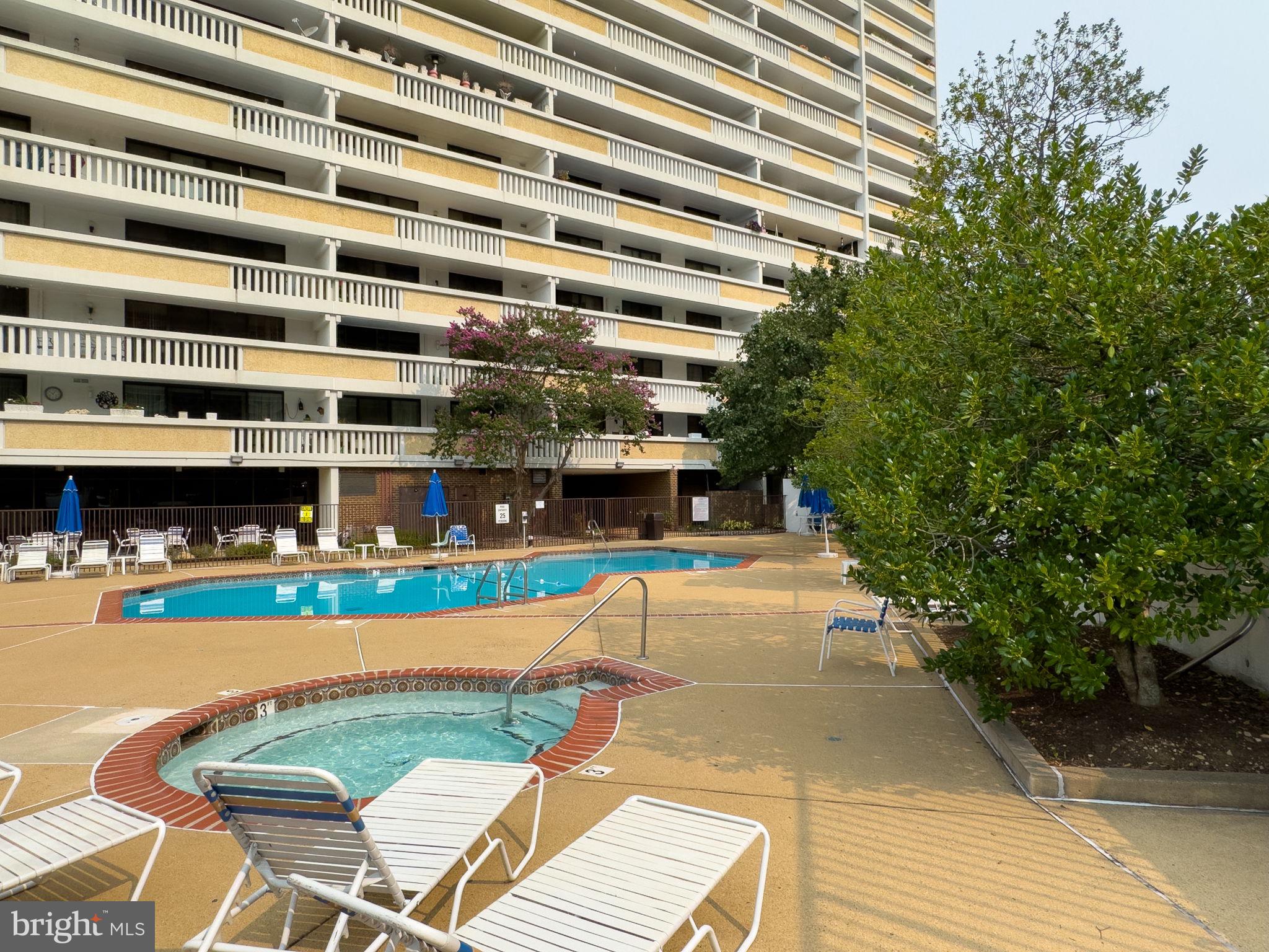 6101 Edsall Road, Unit 1402 Alexandria, VA 22304 - Photo 25 of 37 a view of swimming pool with outdoor seating and plants