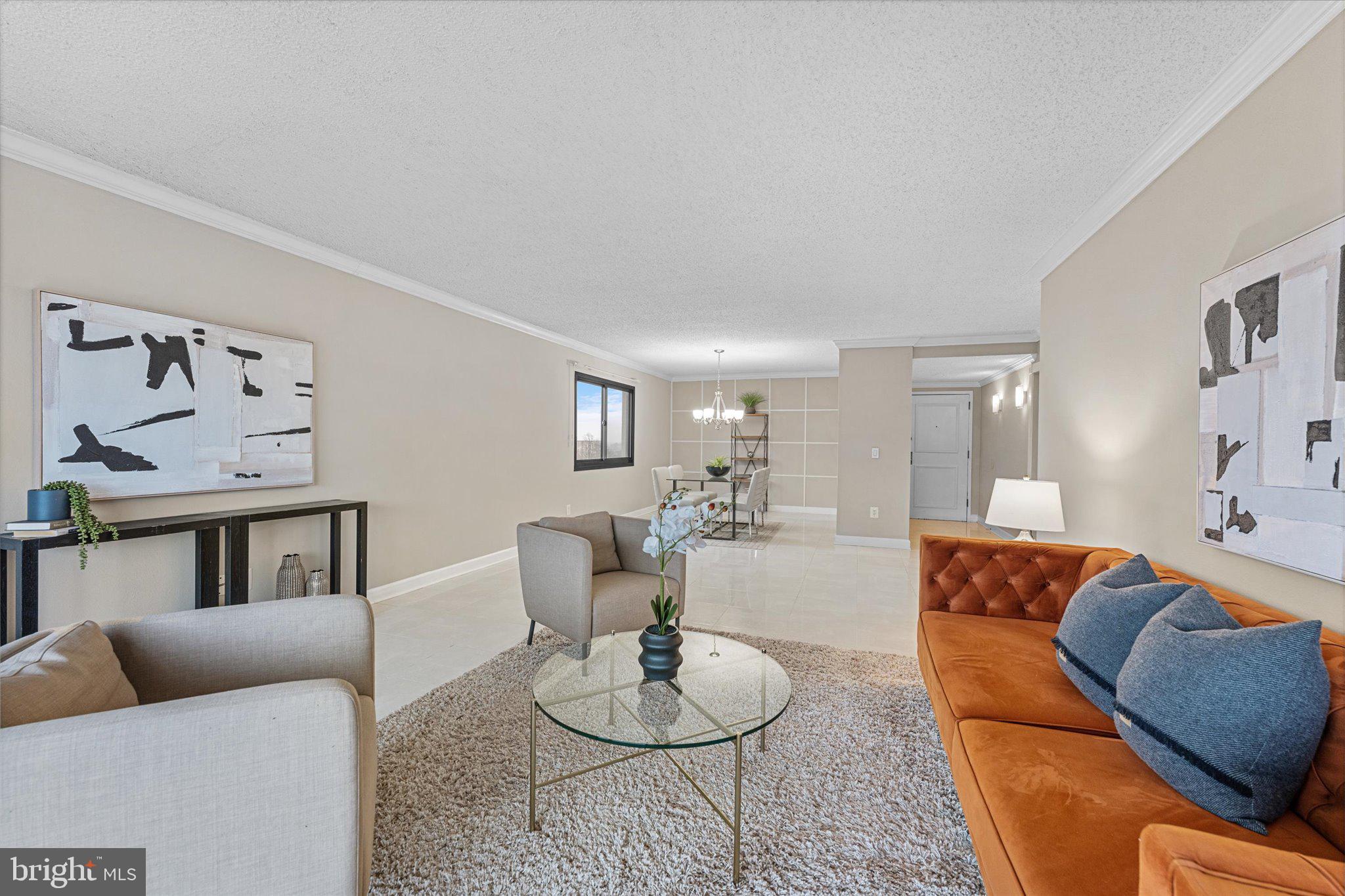 6101 Edsall Road, Unit 1402 Alexandria, VA 22304 - Photo 5 of 37 a living room with furniture and a wooden floor
