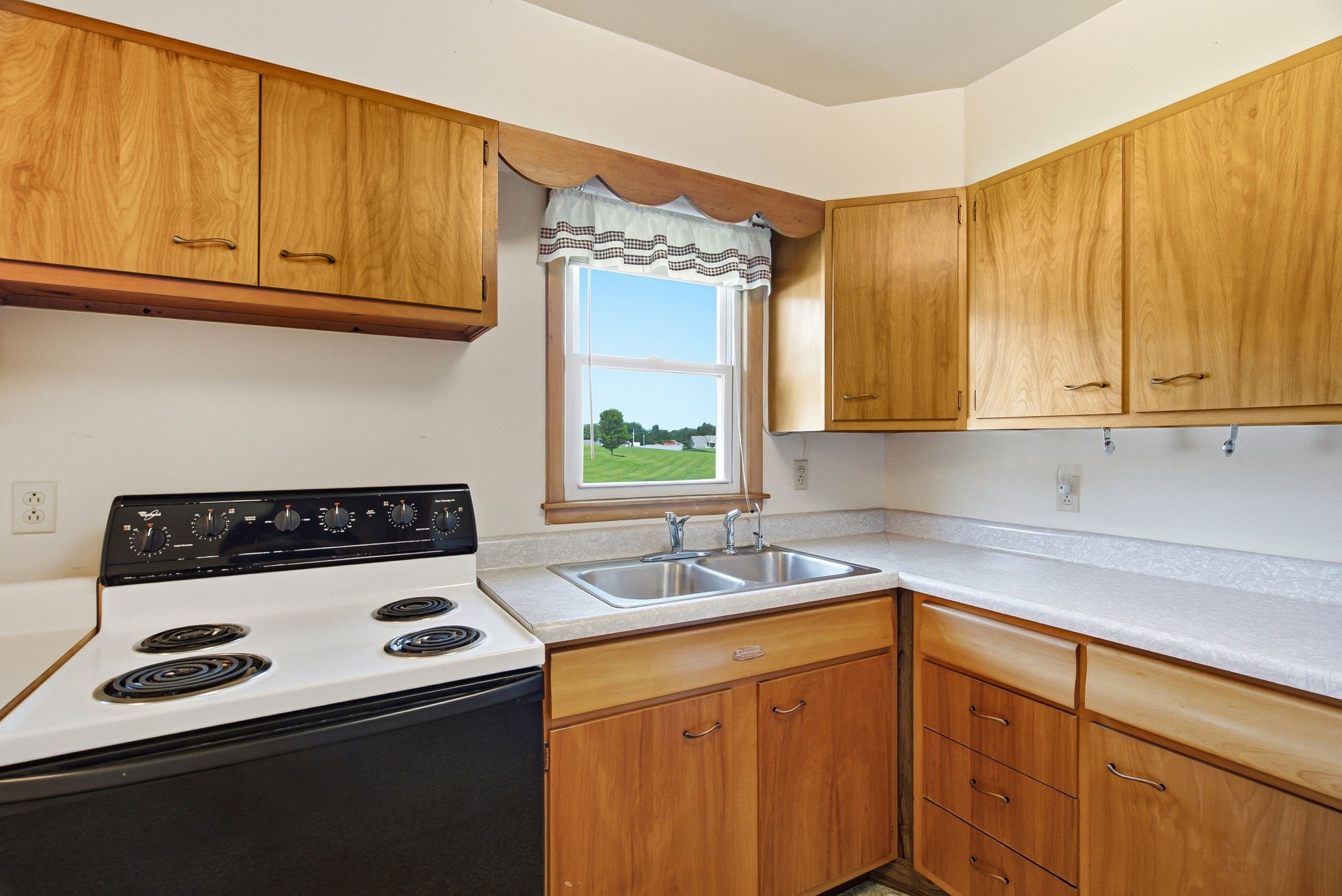 5204 Highway 161 Springfield, TN 37172 - Photo 14 of 40 a kitchen with a sink a stove and cabinets
