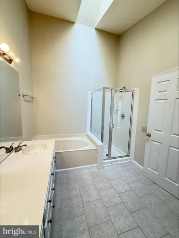 a bathroom with a tub and sink