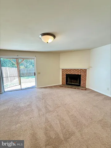 an empty room with a fireplace