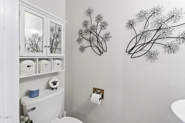 a bathroom with a toilet and a sink