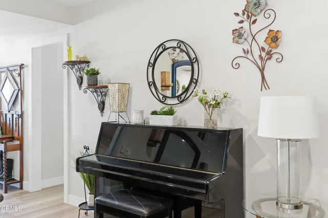 a living room with table and a chair