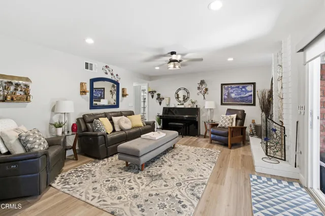 a living room with furniture and a rug