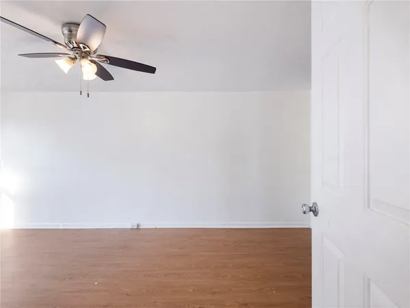 a view of a room with a fan and a window