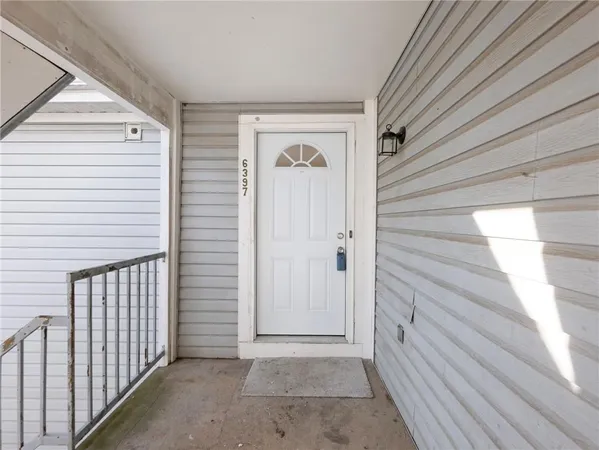 a view of a pathway both side of house