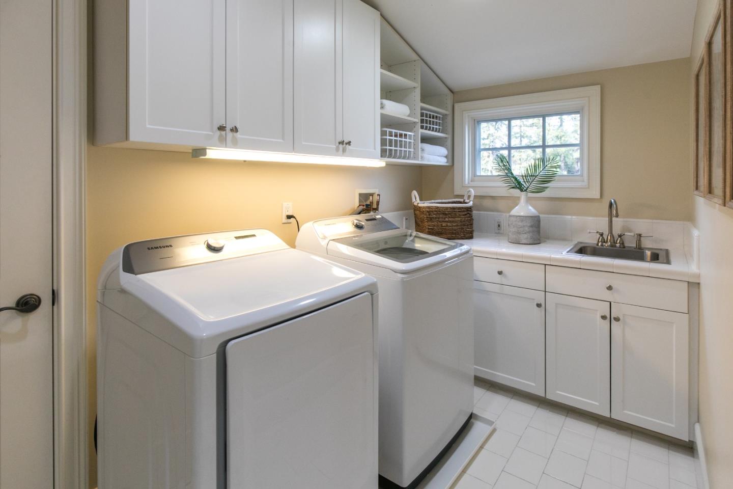 65 Maple Avenue Atherton, CA 94027 - Photo 37 of 45 a utility room with sink dryer and washer