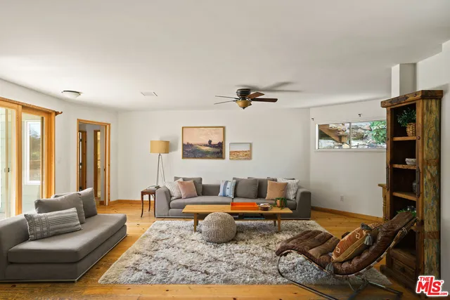 a living room with furniture or couch and a window