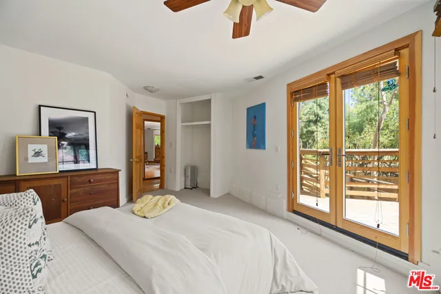 a view of a house with a tree