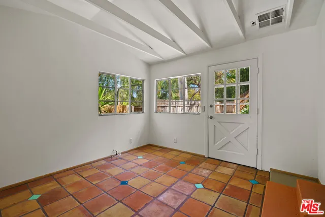 a view of a backyard of the house