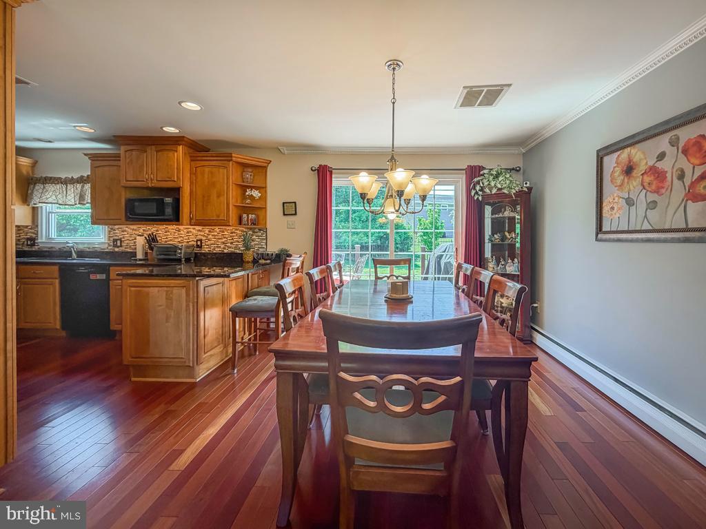925 Big Oak Road Yardley, PA 19067 - Photo 15 of 51 a view of a dining room with furniture window and wooden floor