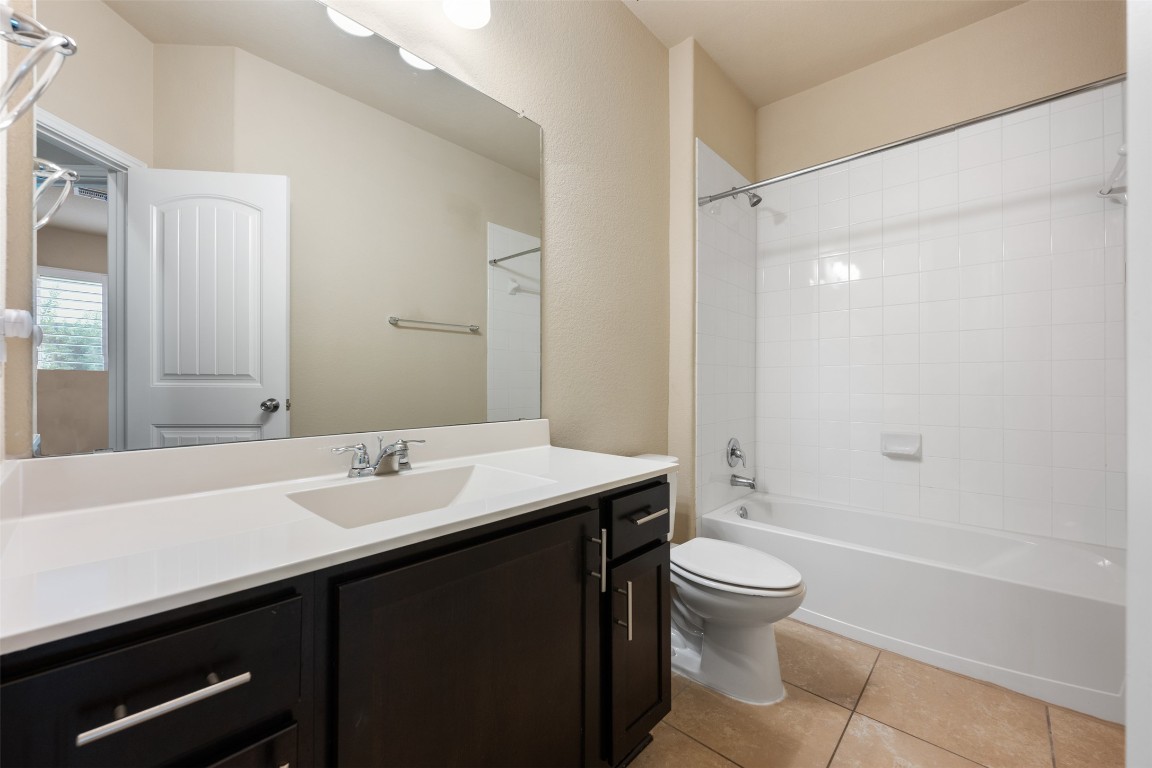 533 Flag Lane Leander, TX 78641 - Photo 20 of 40 Full Bathroom with tile, combo tub/shower for secondary bedrooms.