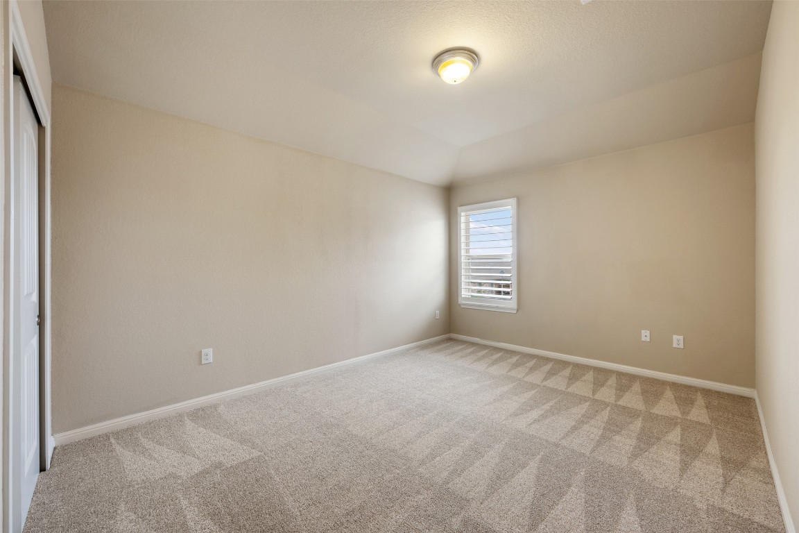 533 Flag Lane Leander, TX 78641 - Photo 26 of 40 Bedroom #4 upstairs with high ceilings, plantation shutters and newly installed carpets.