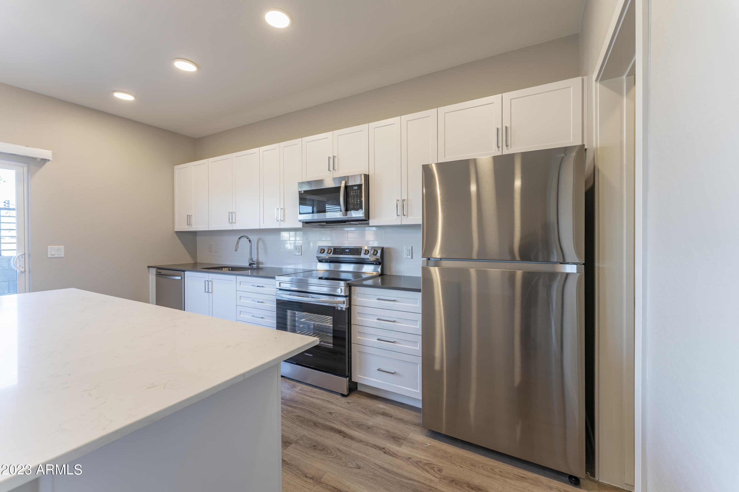 432 South 32nd Street, Unit 114 Mesa, AZ 85204 - Photo 15 of 75 a kitchen with stainless steel appliances a refrigerator sink and microwave