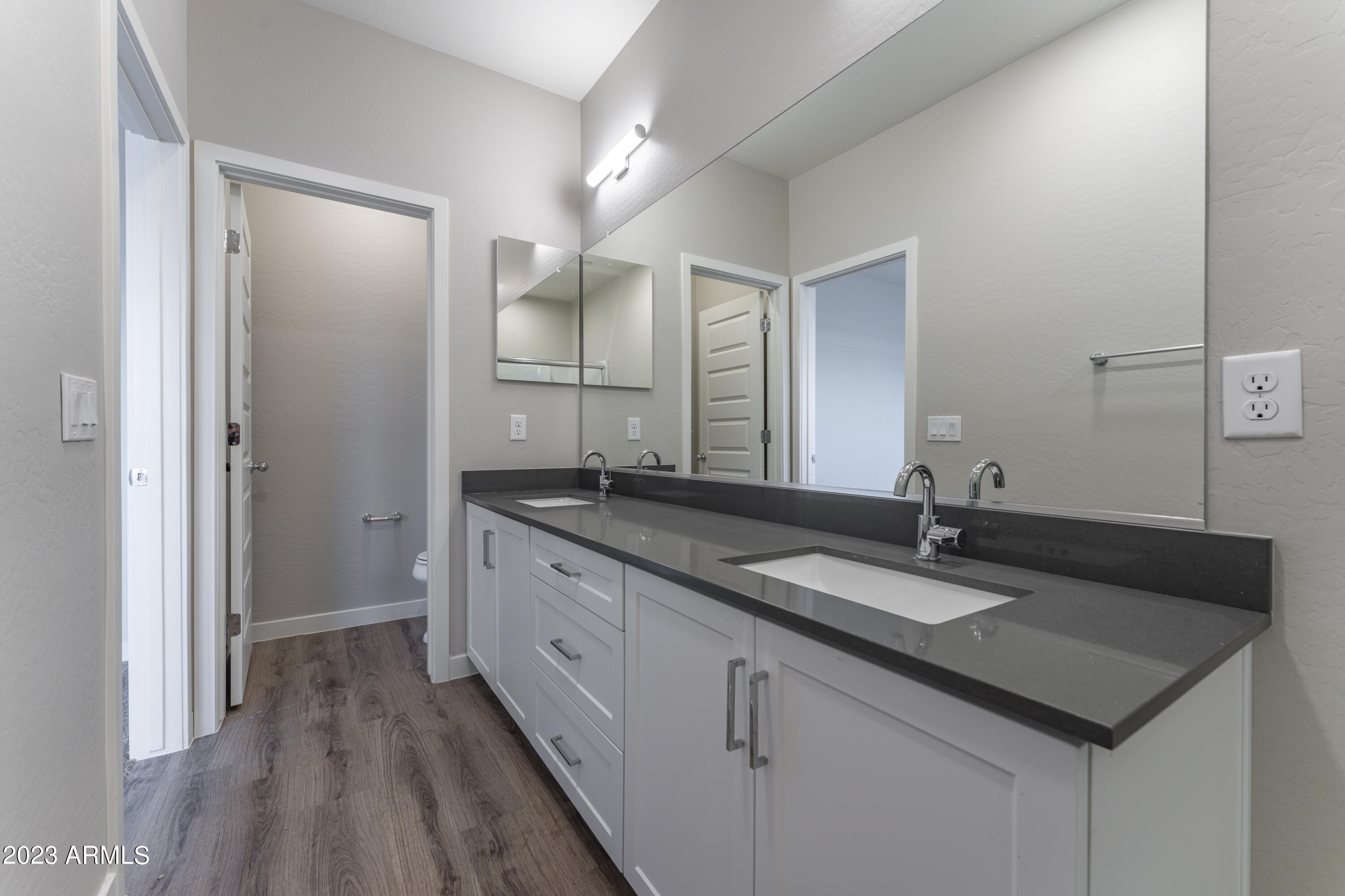 432 South 32nd Street, Unit 114 Mesa, AZ 85204 - Photo 37 of 75 a bathroom with a granite countertop sink and a mirror