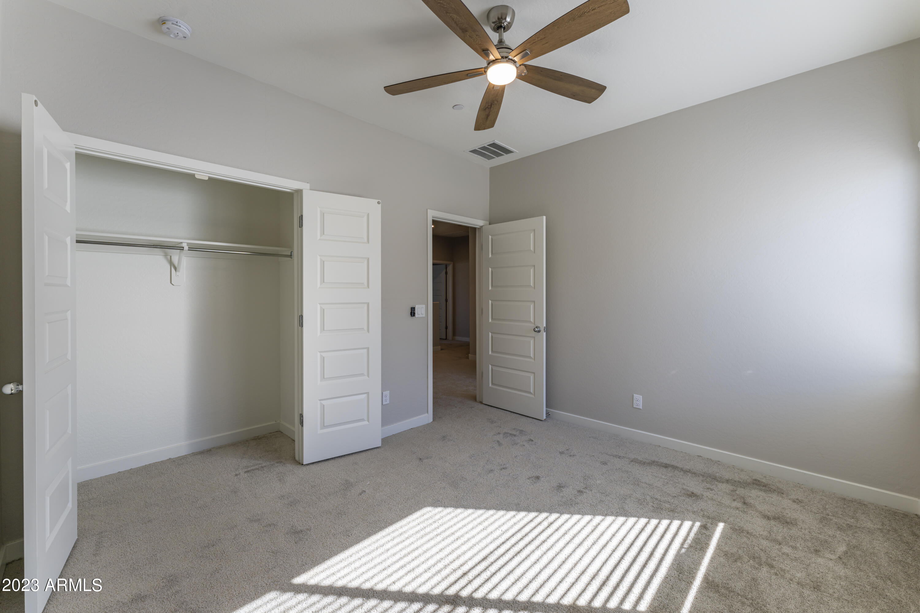 432 South 32nd Street, Unit 114 Mesa, AZ 85204 - Photo 44 of 75 a view of an empty room with a ceiling fan