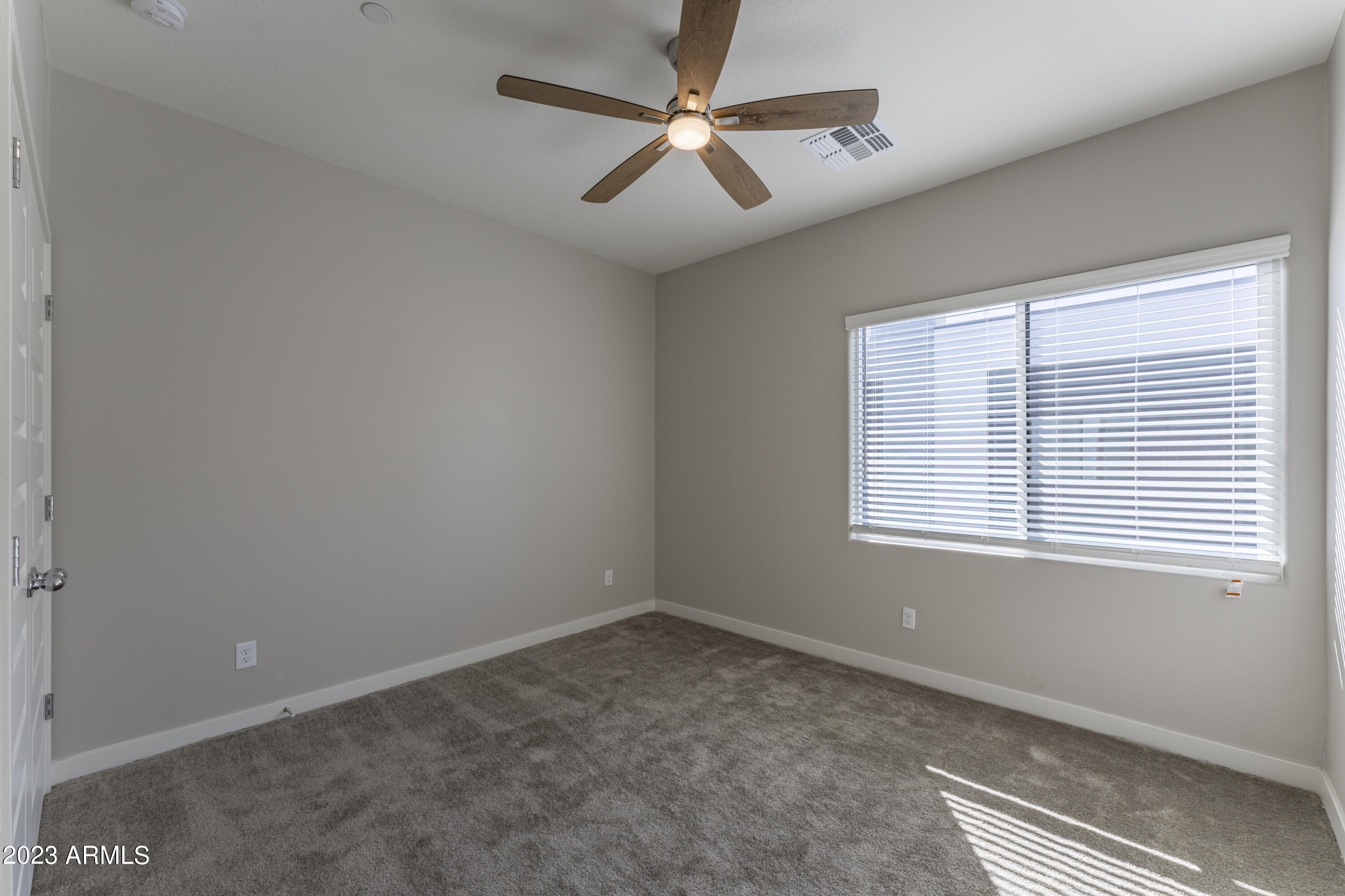 432 South 32nd Street, Unit 114 Mesa, AZ 85204 - Photo 50 of 75 an empty room with a window and a fan