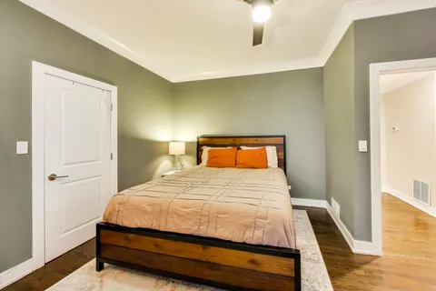 a bedroom with a bed and a dresser