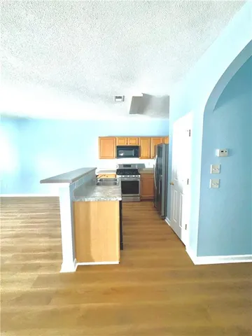 a view of a kitchen with a sink
