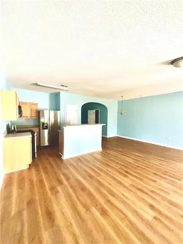a view of a kitchen with furniture and a kitchen