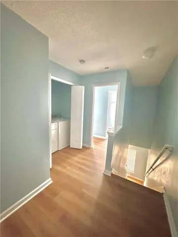a spacious bathroom with a sink and a mirror