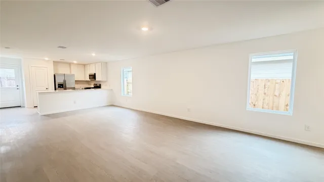 a view of a kitchen with a sink and a window